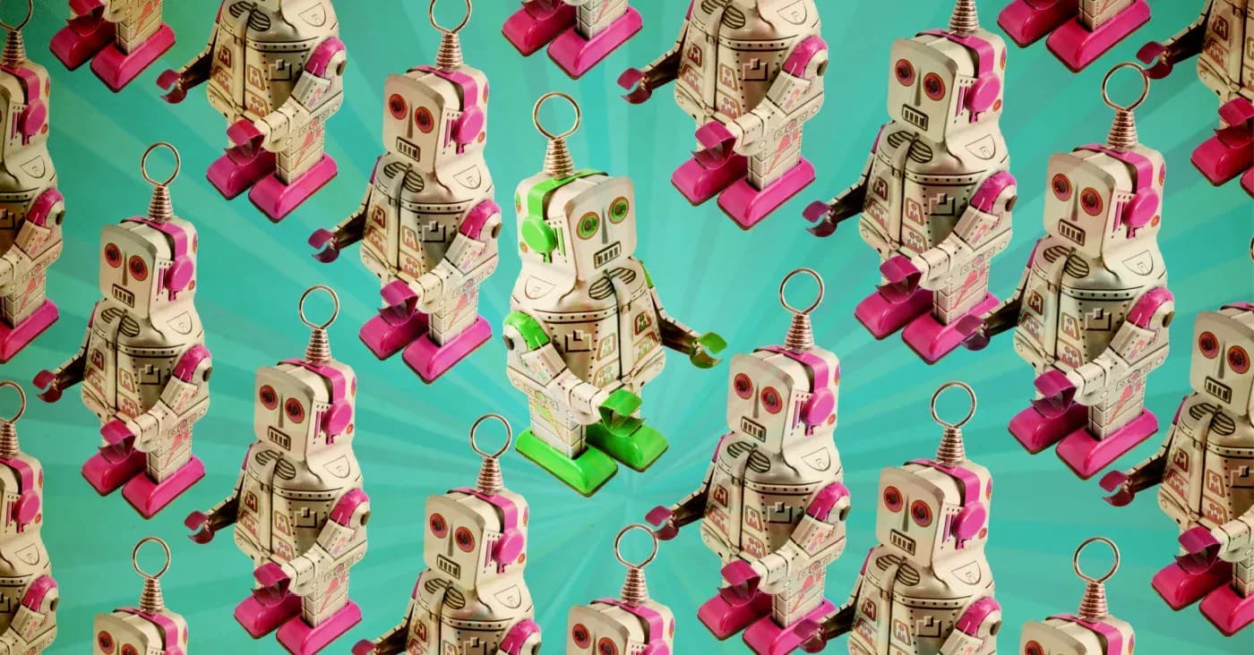 green robot turned facing different way amidst a bunch of pink robots