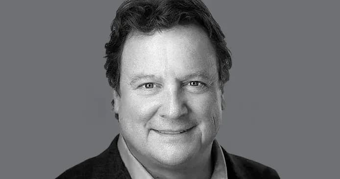 Greg Clark headshot in black and grey